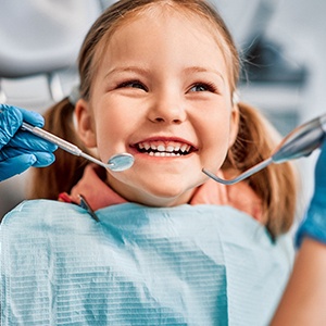 Little girl smiling during a dental checkup and cleaning in Riverton