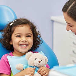 Little girl smiling in the treatment chair