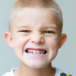 a young boy with metal braces 