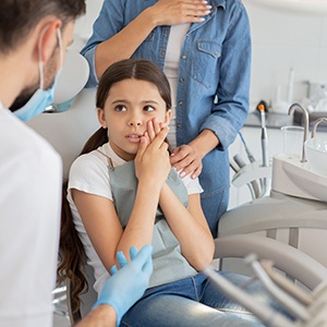 A young girl about to get emergency dental care