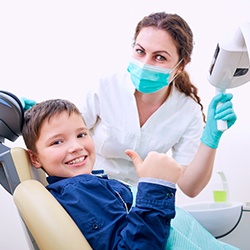 Young boy smiling at the dentist’s office