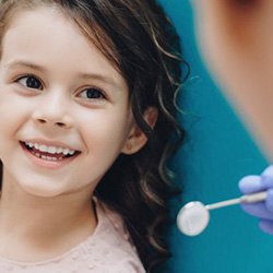 Dentist about to examine a child’s teeth