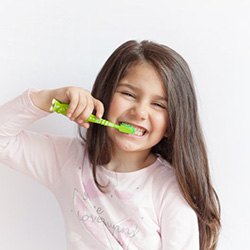 Girl brushing her teeth